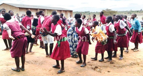 School children dance during the launch of Mamaye clubs