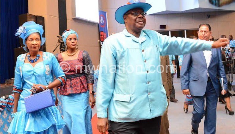 Mutharika gestures on arrival at BICC Sunday for the launch
