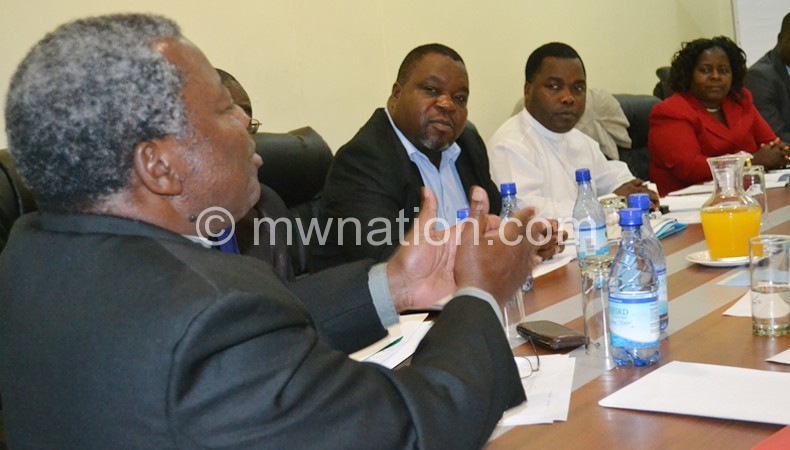 Chingota (L) stressing a point during the meeting with MEC Wednesday