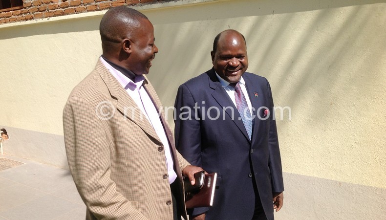 Chimunthu Banda (R) shares lighter moment with Mesn Chairperson Steve Duwa