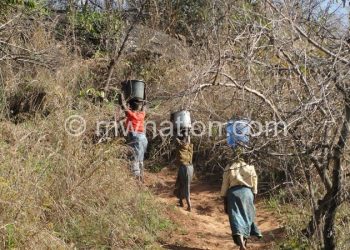 Village women endure bad terrain and long
distances to fetch water for home use
