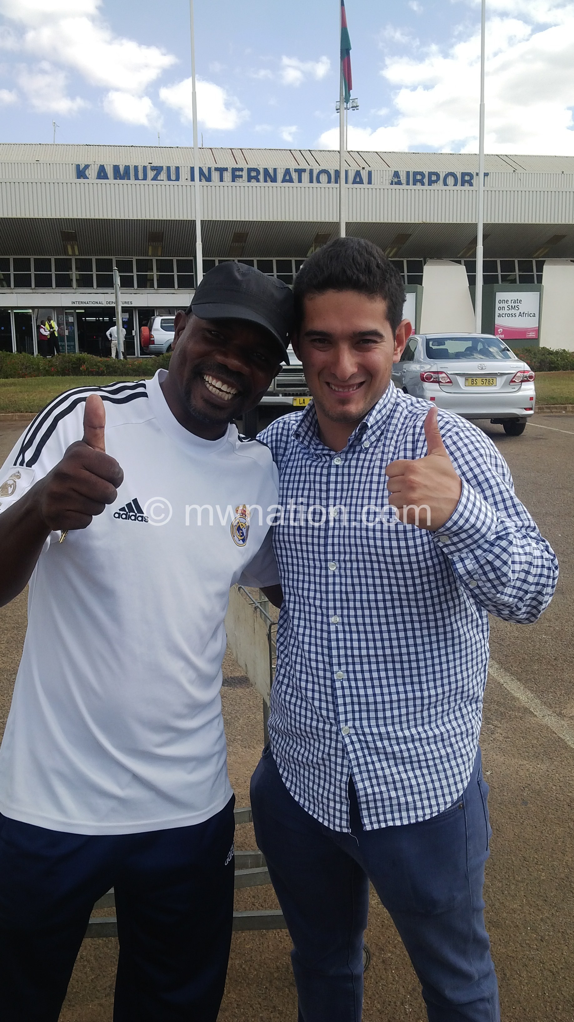 Vasquez (R) from Madrid being welcomed at Malawi's Kamuzu International Airport (KIA) by Msowoya