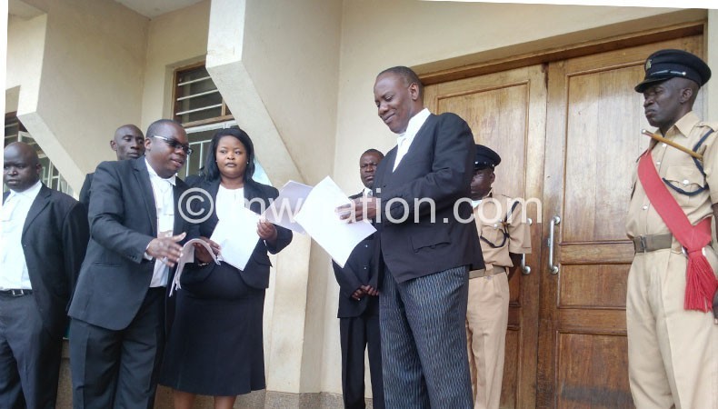 MLS Mzuzu Chapter president Victor Gondwe presenting a 
petition to Madise in this file photo