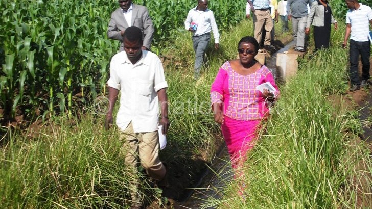 Erica Maganga(R) touring Chombe Irrigation Scheme in Zomba District