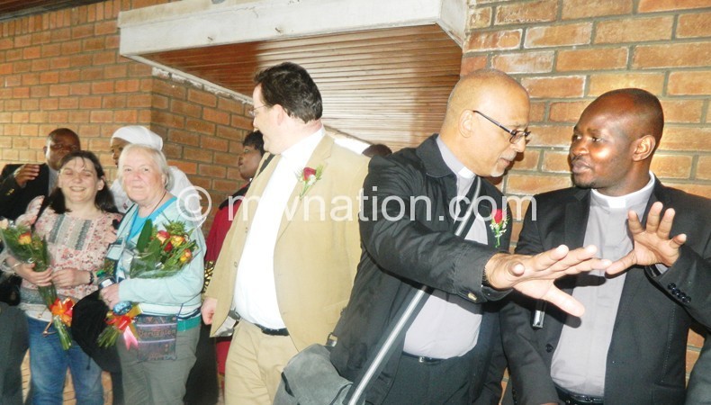Maulidi (R) and Smith in welcome gestures at Chileka Airport
