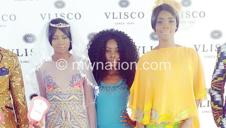 Misomali (C) with models who showcased her designs at the event