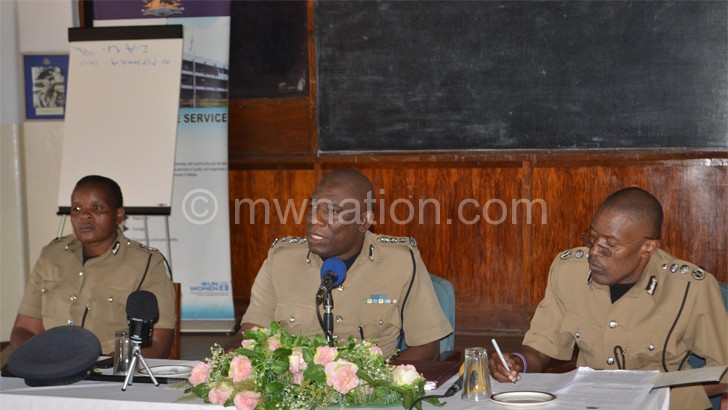 No clues: Luhanga (C) briefing journalists flanked by National Police spokesperson Rhoda Manjolo (L) and Jimmy Gama