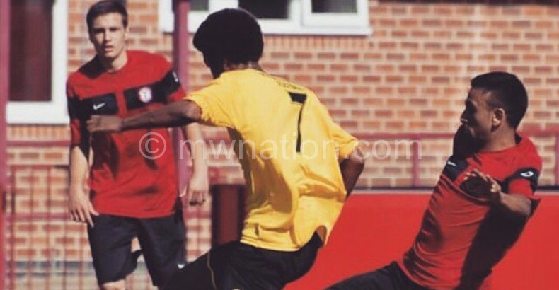 Msungama (C) in action for Eaton Town in England