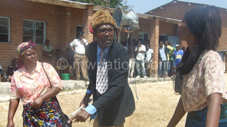 Mwakaghe (C) and other members of his cast staging a play in Karonga recently