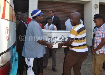 Zingale’s casket is carried out of the mortuary