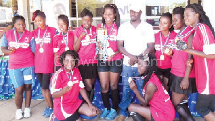 Genetrix ladies’ team show off their trophy and medals