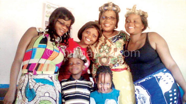 Tembenu (in glasses in the middle) with her family members