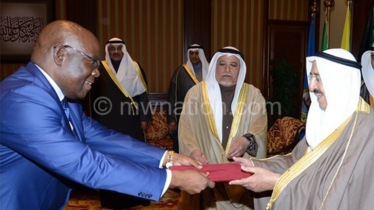 Ali (L) presenting Credentials to Sheikh Sabah Al-Ahmad