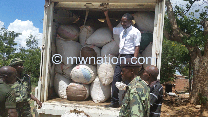 Police officers inspect the chamba that was intercepted at Lirangwe