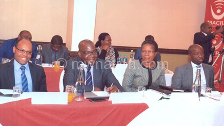 Itaye (R), NSO commissioner of statistics Mercy Kanyuka, Macra deputy director general Francis Bisika and Macra director of finance and administration Ben Chitsonga (L) follow proceedings