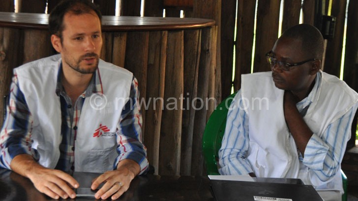 Gregoire (L) making a point as MSF Advocacy and Communications Manager
Benedicto Chinsakaso looks on