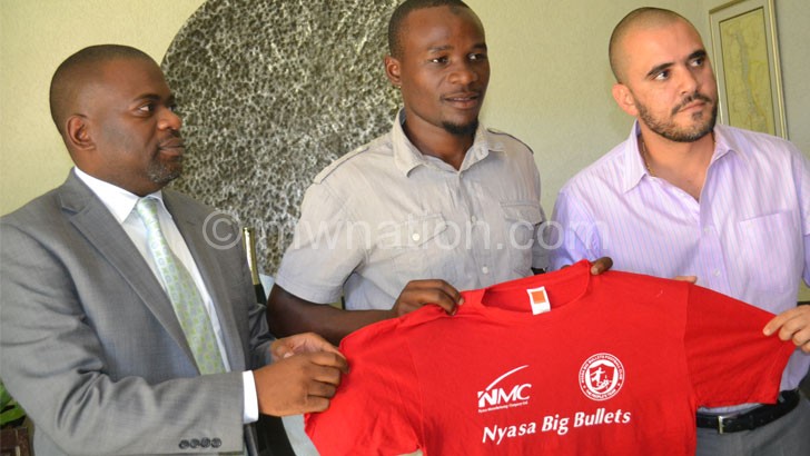 New catch: Sulumba (C) being unveiled at by  Bullets chairman  Chilunga