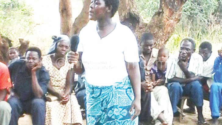 Villagers discuss women empowerment at a community gathering