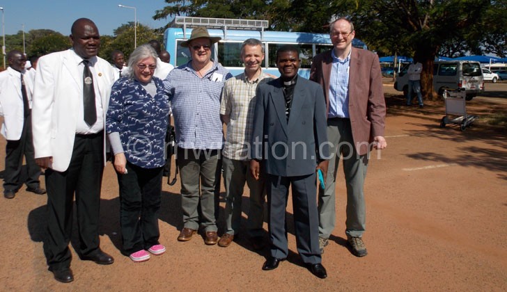 The Mid-Argyll delegation upon their arrival pose with Parish Minister Rev Kapombe Mwale (2nd Right)