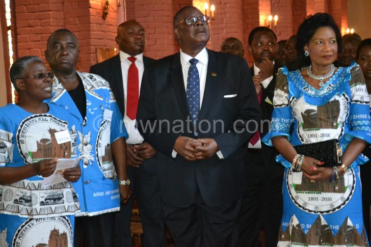 Mutharika being briefed on the history of the church by Pauline Ntonga