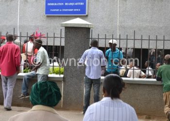 People queue for passports at Immigration
Headquarters in this file photo