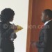 Patemba (L) confers with committee clerk Fred Kamwani outside he meeting room