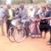 Community members receiving bicycles from Chinansi officials