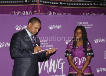 Chilima signs a pledge card to mark official launch of Evawg on Tuesday