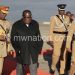 Gondwe (C), flanked by Malawi Police Service inspector general Rodney Jose (R) and Malawi Defence Force deputy commander Clement Namangale during during the presidential send off