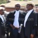 Respondents’ lawyers Kaphale (L), Mbeta (C) and Samuel Tembenu consult during hearing