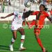 Tabitha Chawinga (R) in action against Kenya in women’s football Olympic qualifier
