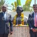 Mkaka (L) poses with Bhushan after unveiling the bustduring