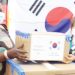 Chiponda (L) receives the donation from a Korean representative