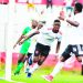 Bullets striker Chiukepo Msowoya (in white) challenged by Moyale Barracks players on Sunday