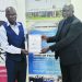 Gondwe (L) exchanges the MOU with Phiri
