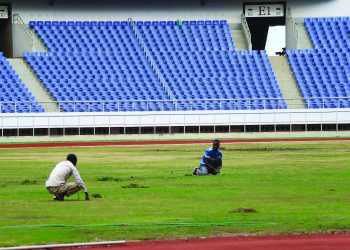 Groundsmen working on Bingu Stadium pitch