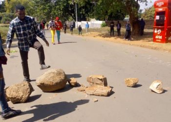 Unima students block a road during the protests