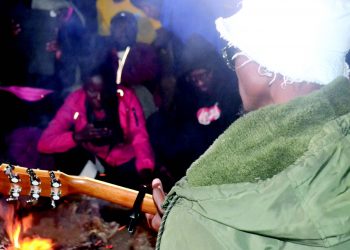 Lawi dishes out a song by the bonfire at Chisepo Hut