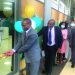 Kumwenda (L) cuts a ribbon to open Block Management System satellite office