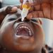 An HSA adminsters polio vaccine